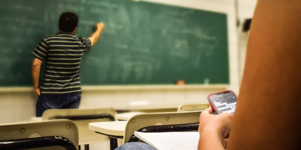 student distracted on phone during class
