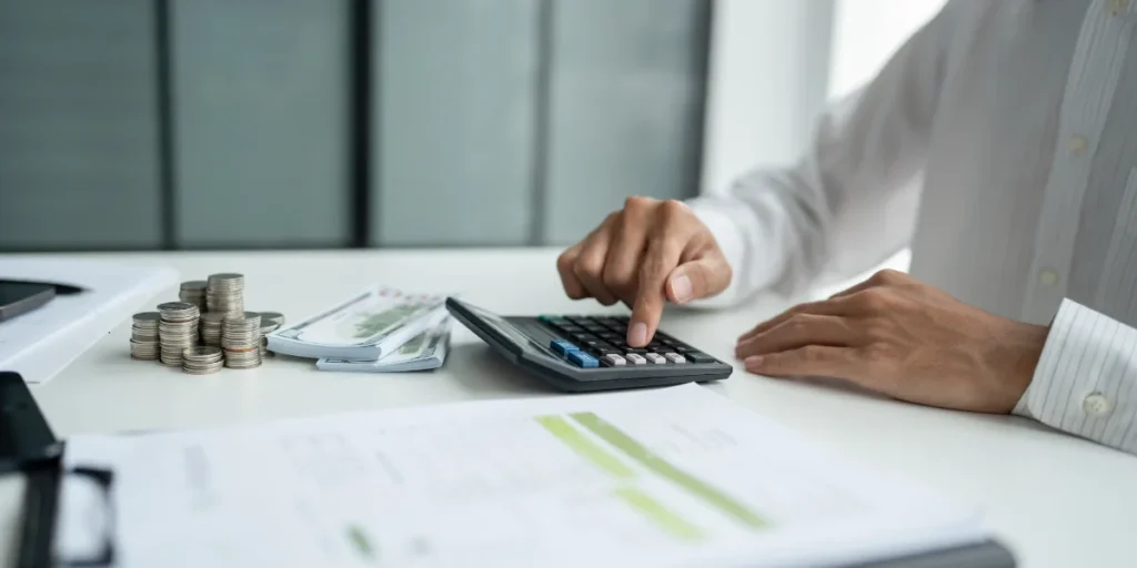 businessman doing calculations